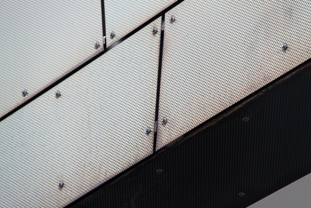 Perforated mesh shadow on concrete floor Stock Photo - Alamy